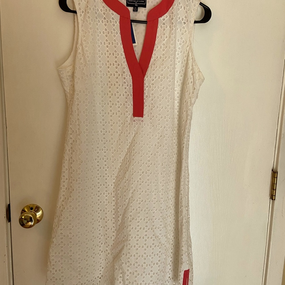 White dress with coral collar outline